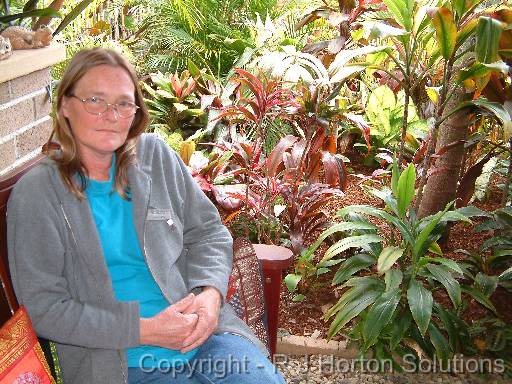 Helen Curran in tropical garden 